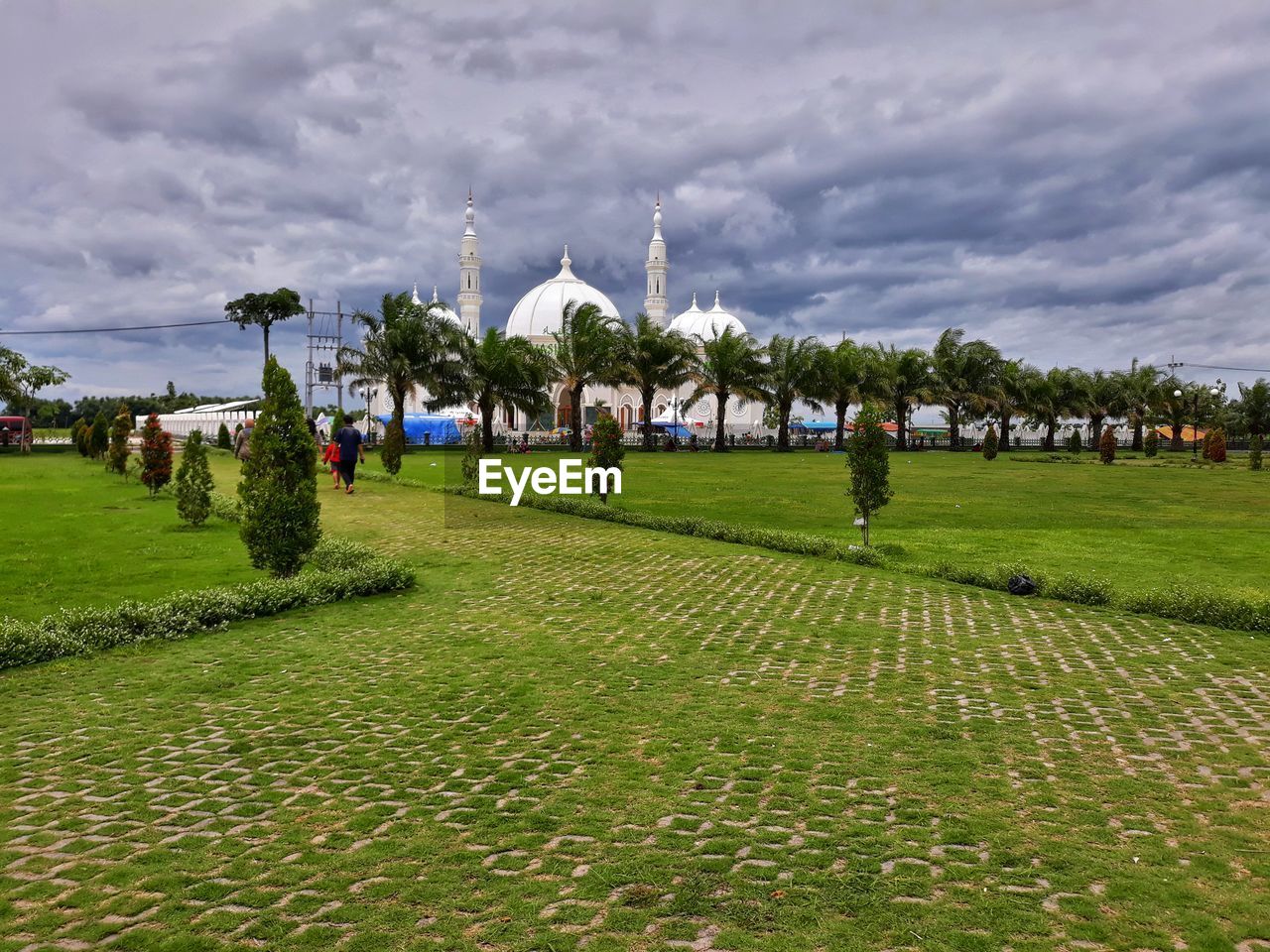 View of buildings against cloudy sky