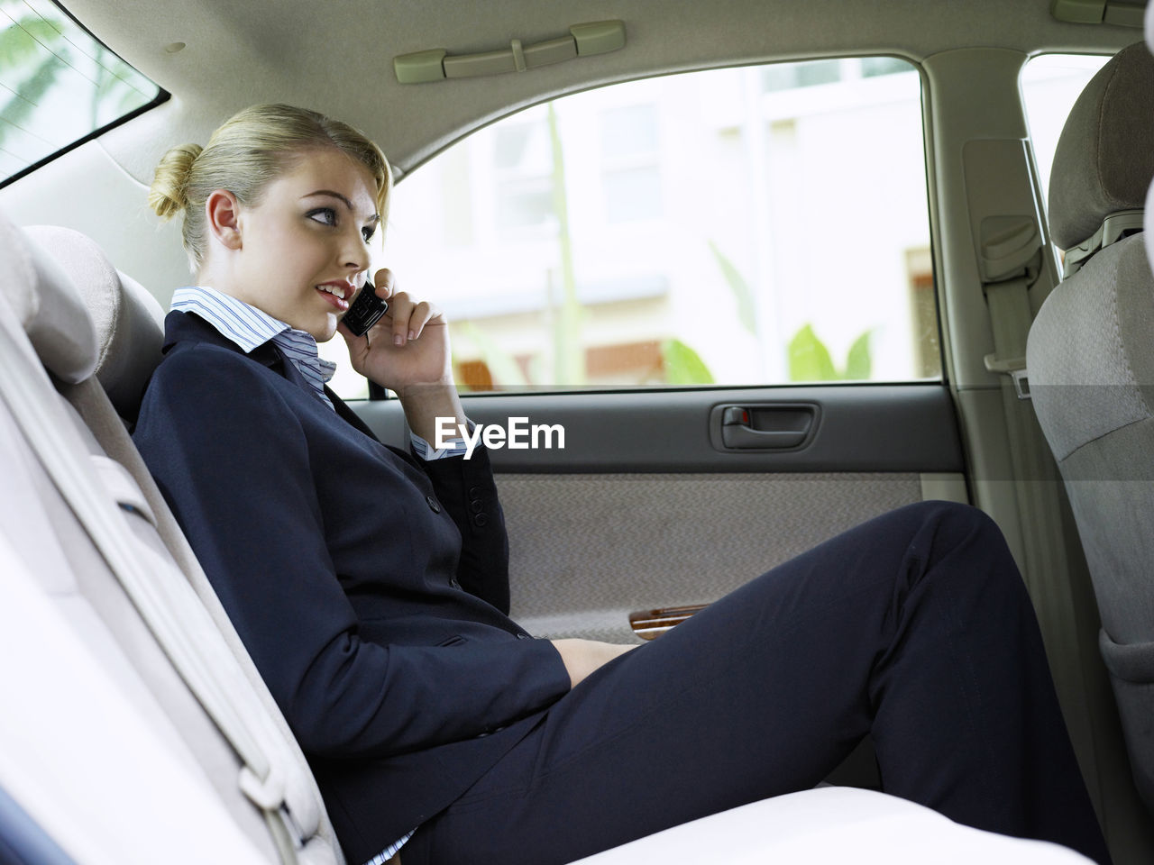 FULL LENGTH OF WOMAN SITTING IN BUS