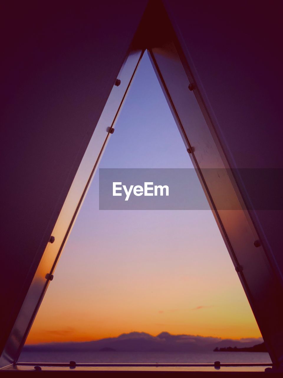 Low angle view of silhouette beach against sky during sunset