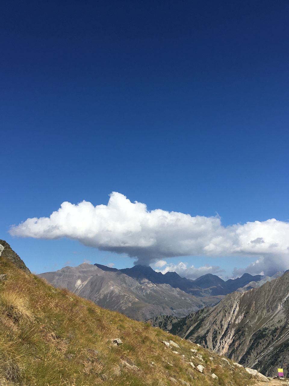 SCENIC VIEW OF LANDSCAPE AND MOUNTAINS AGAINST BLUE SKY