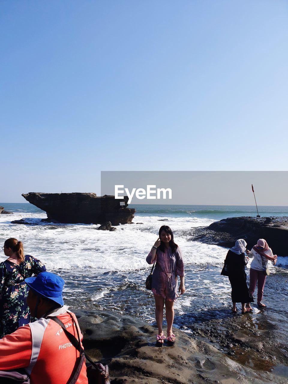 water, sea, group of people, sky, beach, nature, land, coast, men, adult, clear sky, ocean, horizon over water, horizon, day, nautical vessel, blue, leisure activity, transportation, women, holiday, copy space, boat, adventure, vehicle, trip, vacation, sports, travel, sunny, full length, outdoors, beauty in nature, water sports, motion, medium group of people, shore, group, scenics - nature, boating, standing, lifestyles, sunlight, rear view, togetherness, young adult, travel destinations, person