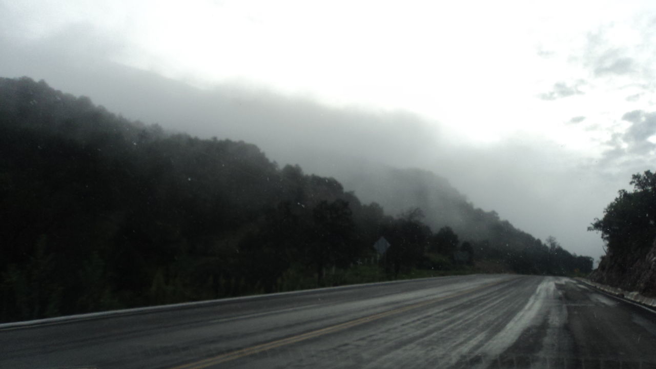 ROAD LEADING TOWARDS MOUNTAINS