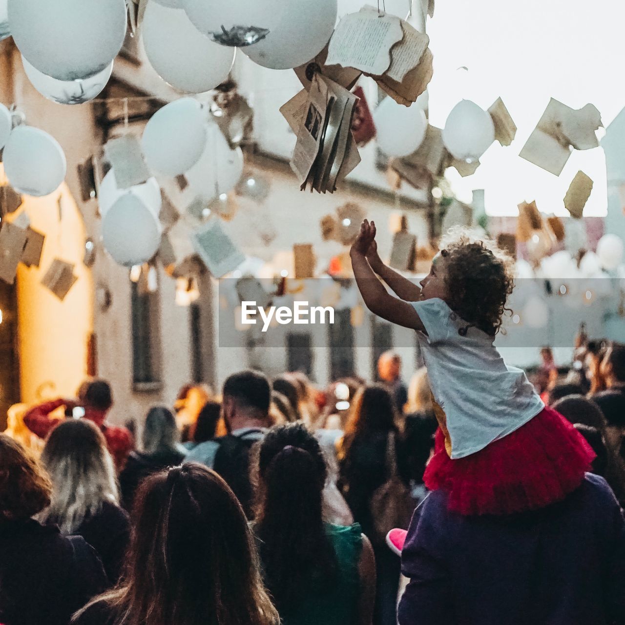 GROUP OF PEOPLE IN TRADITIONAL BUILDING