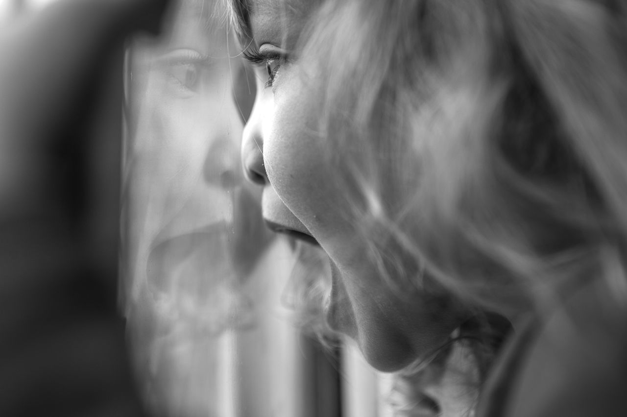 CLOSE-UP OF YOUNG WOMAN WITH HAIR