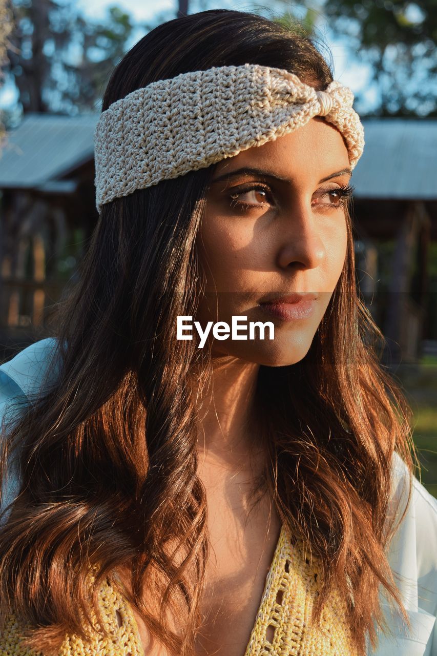 Close-up of young woman looking away