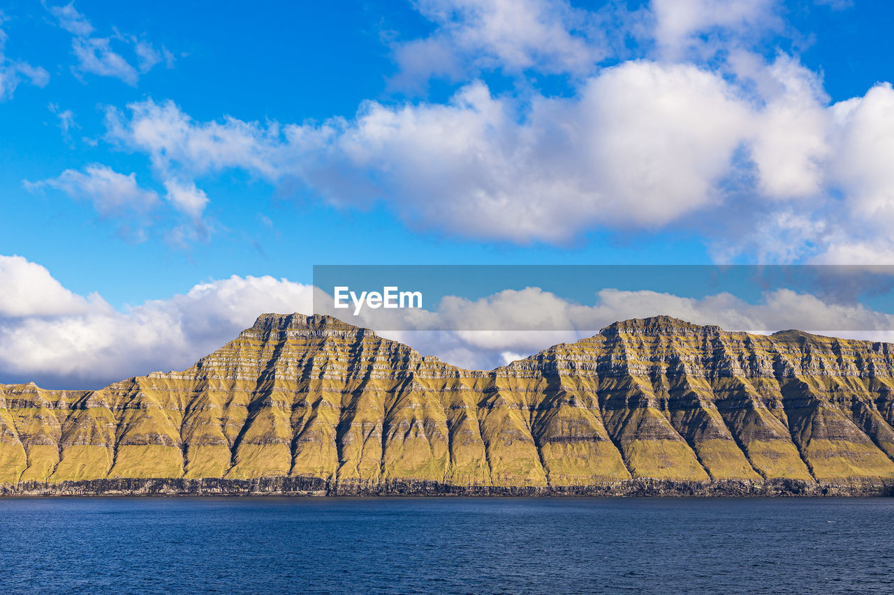 panoramic view of rocky mountains against sky