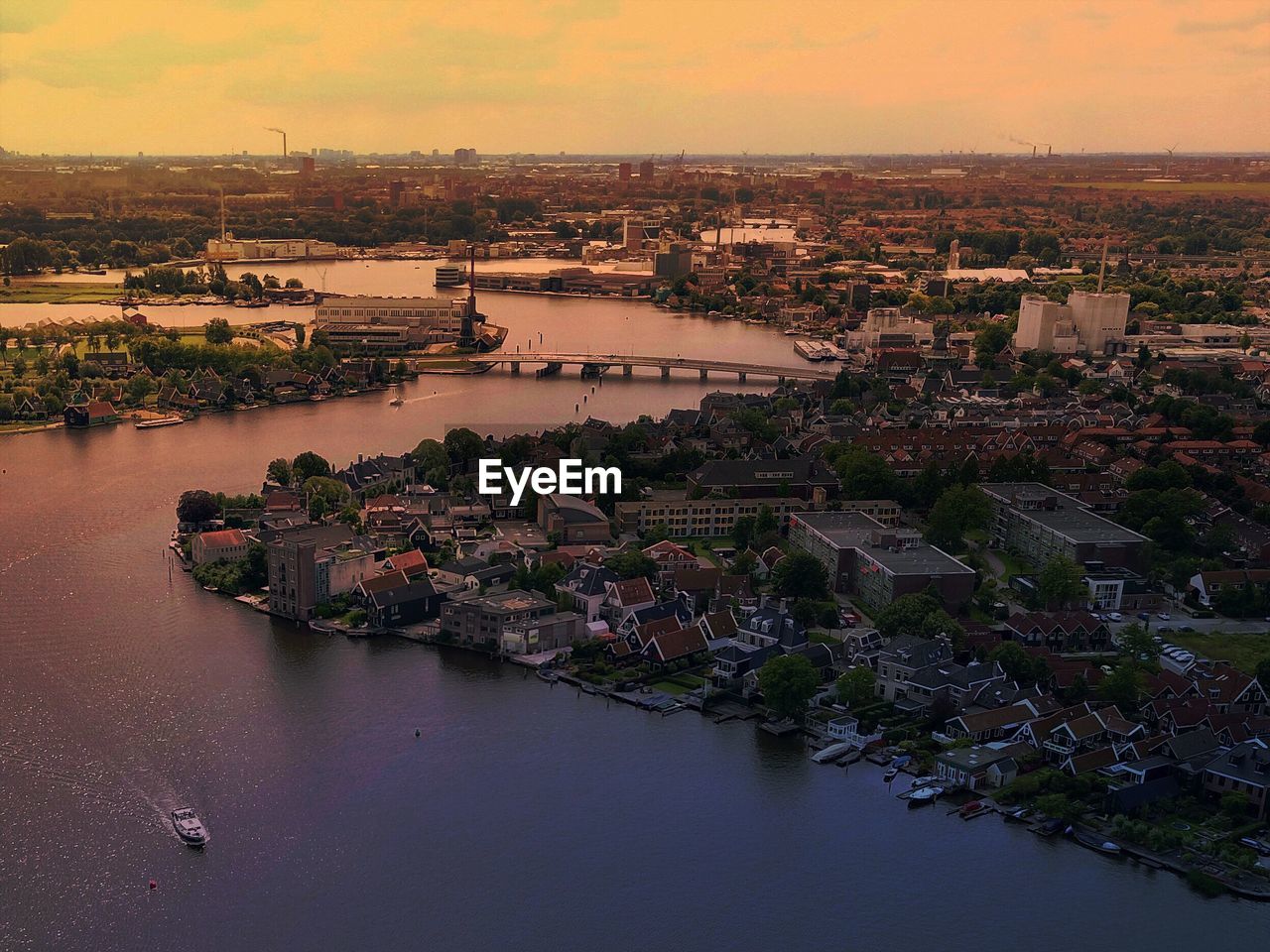 Aerial view of city against sky during sunset