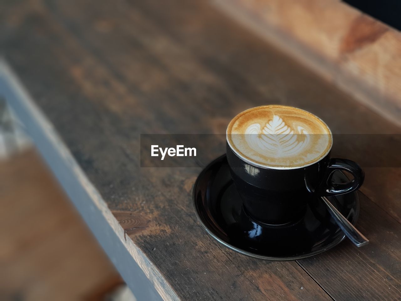 Close-up of coffee cup on table