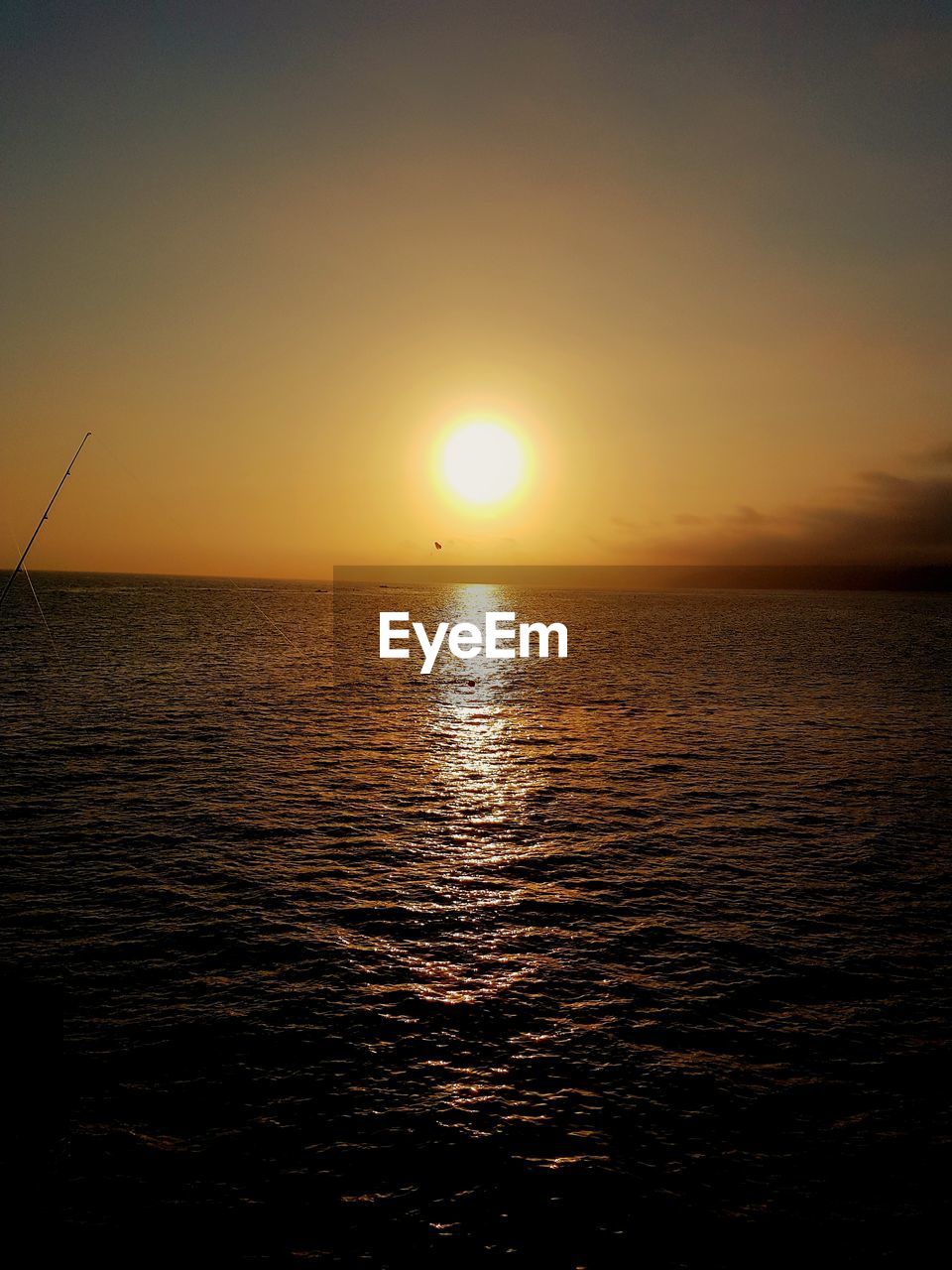 Scenic view of sea against clear sky during sunset