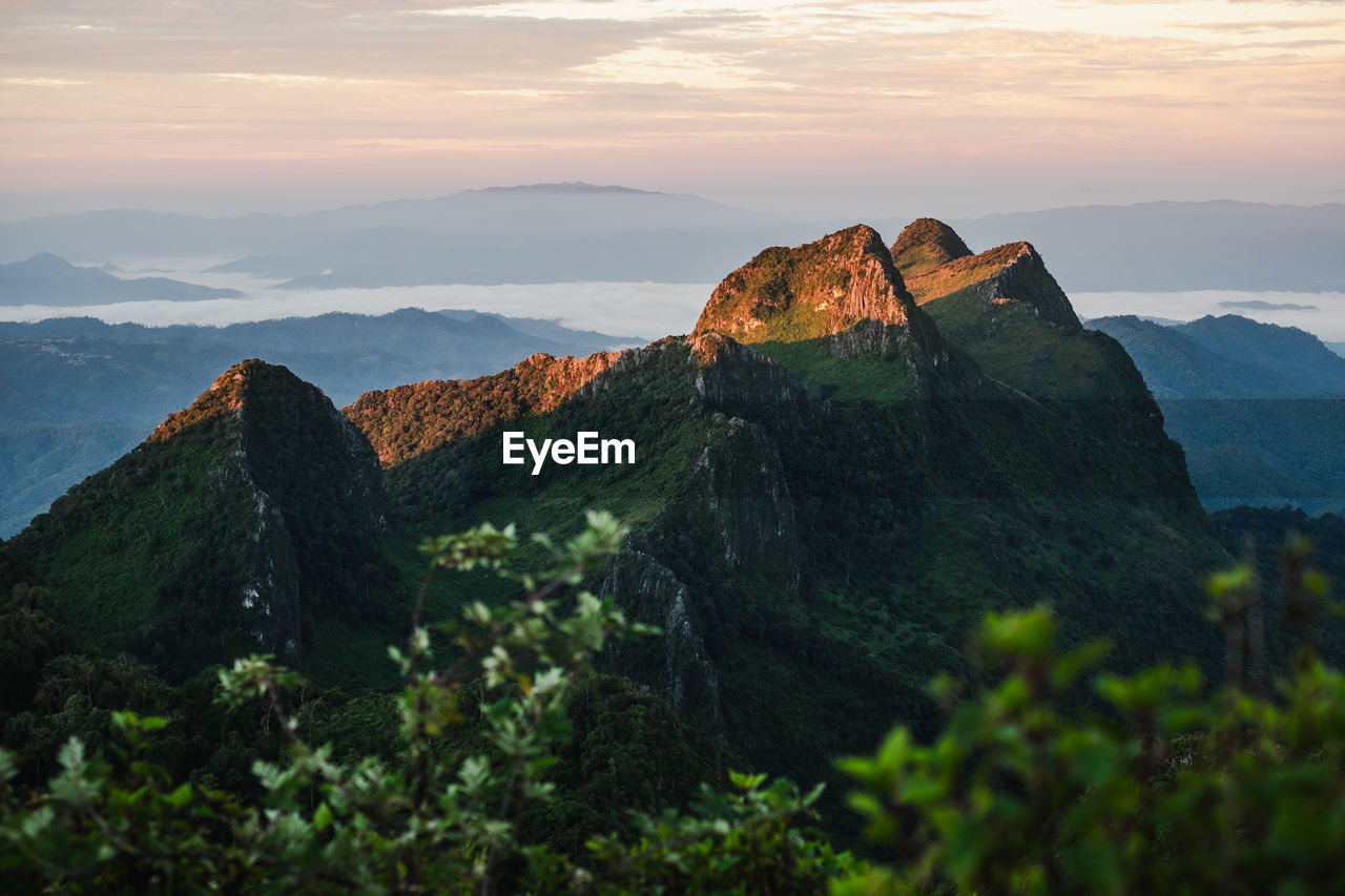 Scenic view of mountains against sky during sunset