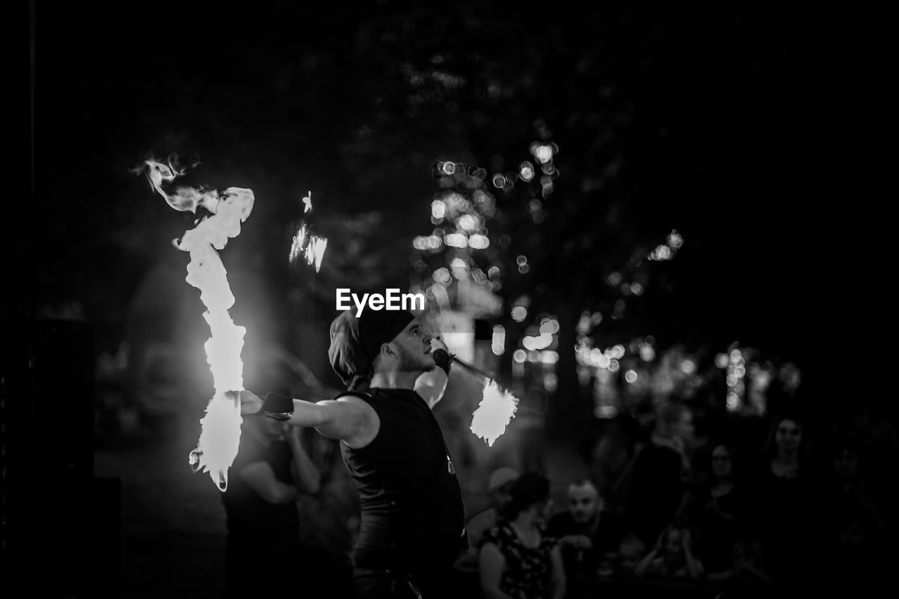 GROUP OF PEOPLE ENJOYING MUSIC CONCERT