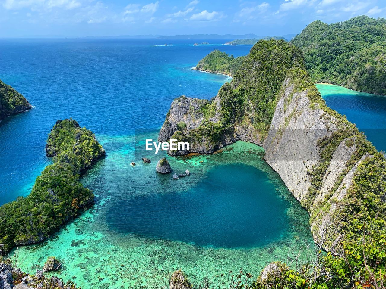 High angle view of rocks in sea of love lagoon in misool island raja ampat