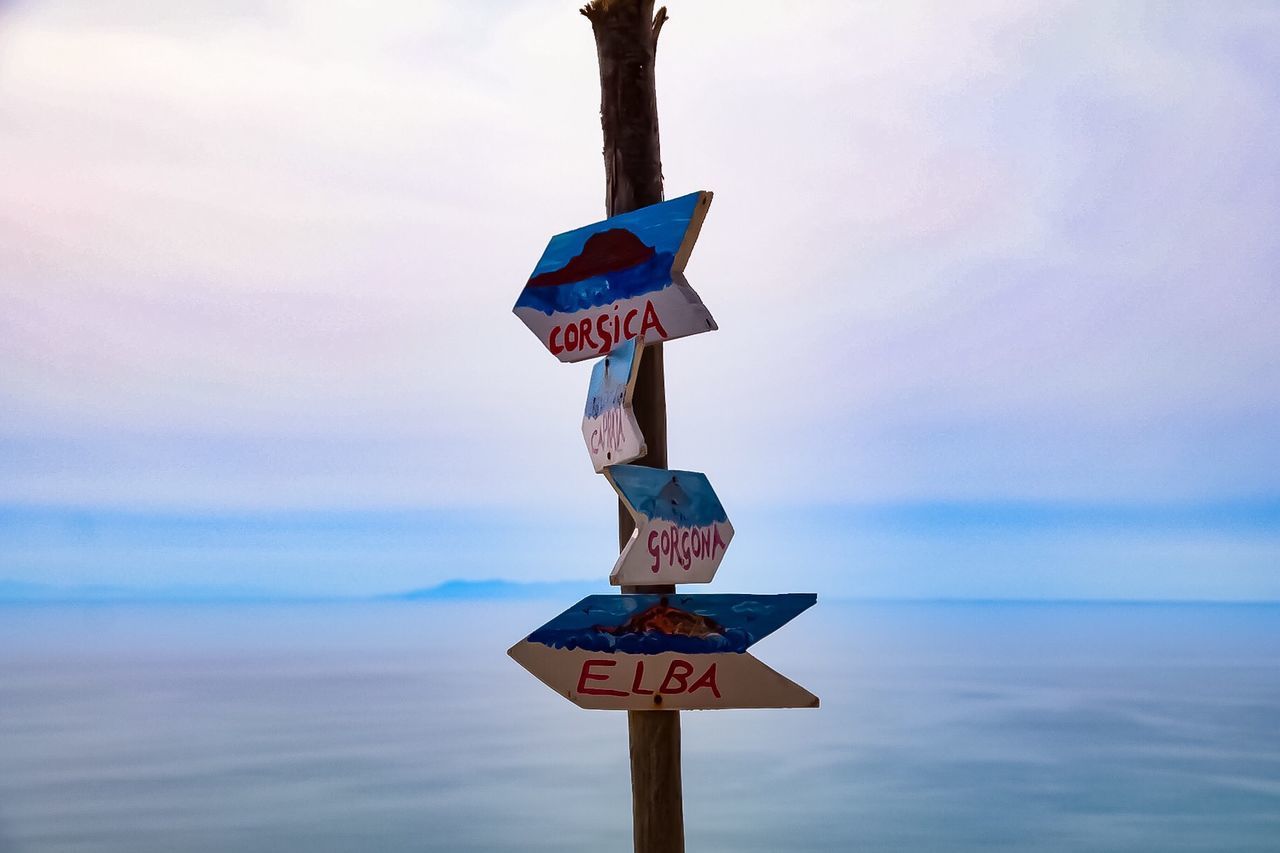 ROAD SIGN AGAINST SKY