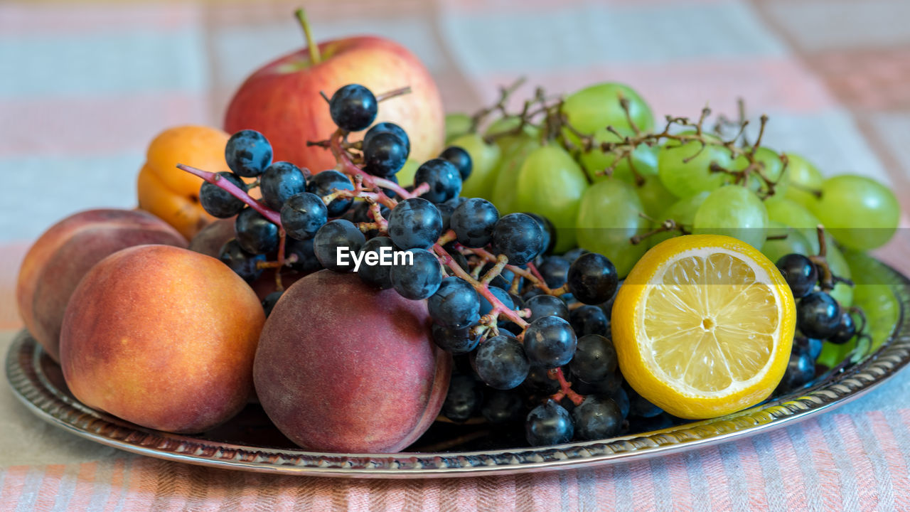 Close-up of fruits in plate on table