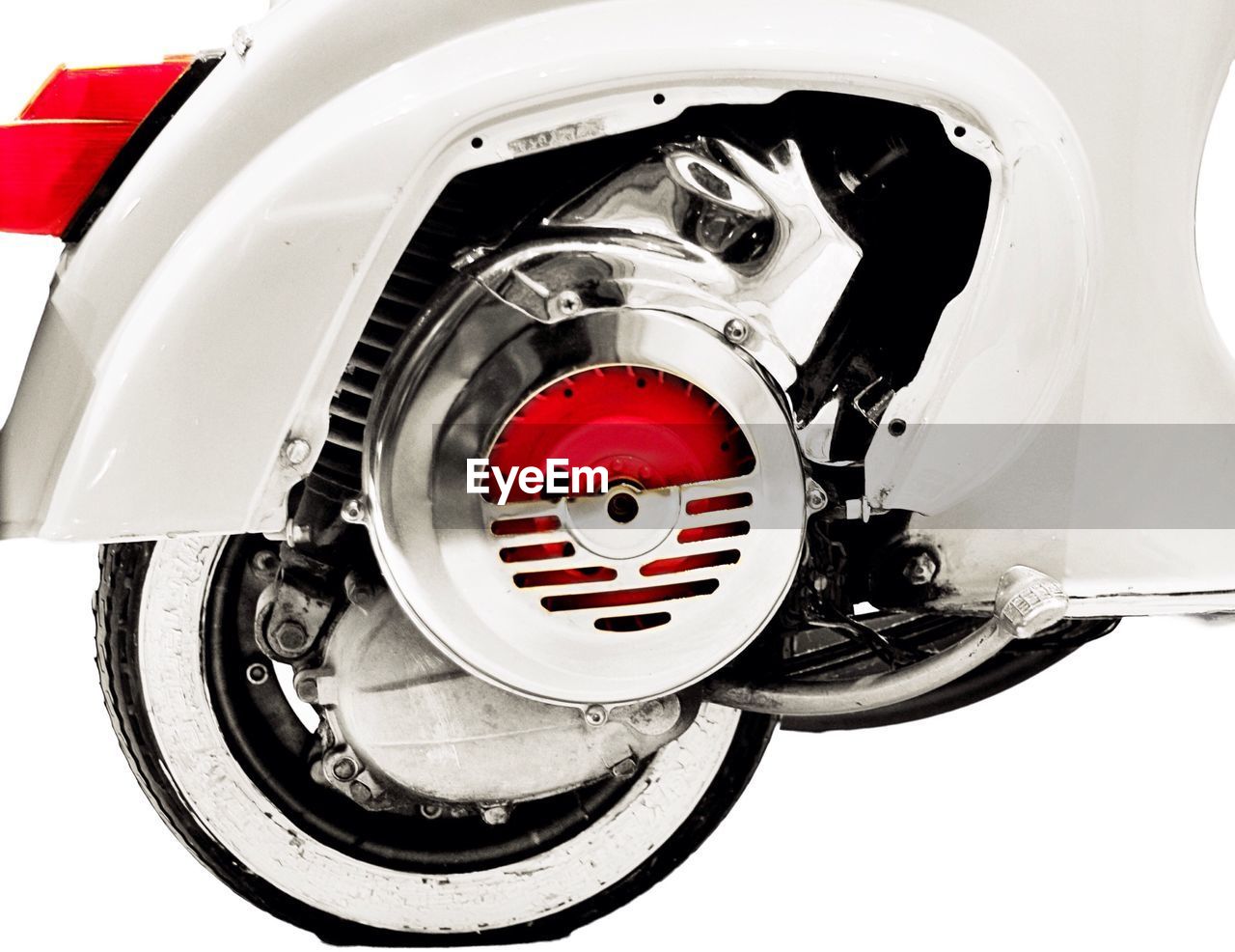 Cropped image of white scooter against white background