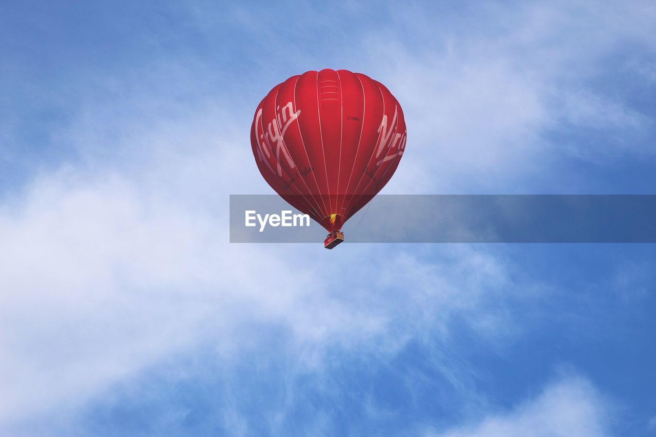 LOW ANGLE VIEW OF HOT AIR BALLOONS FLYING AGAINST SKY