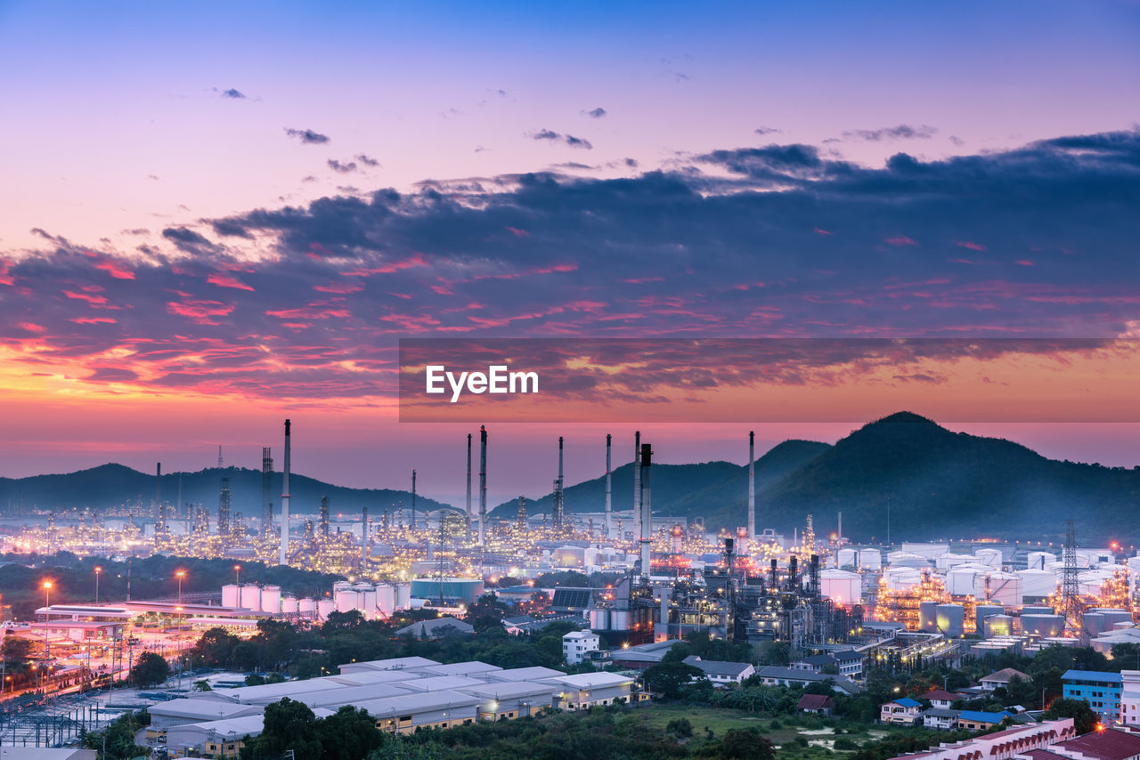 CITYSCAPE AGAINST SKY AT SUNSET