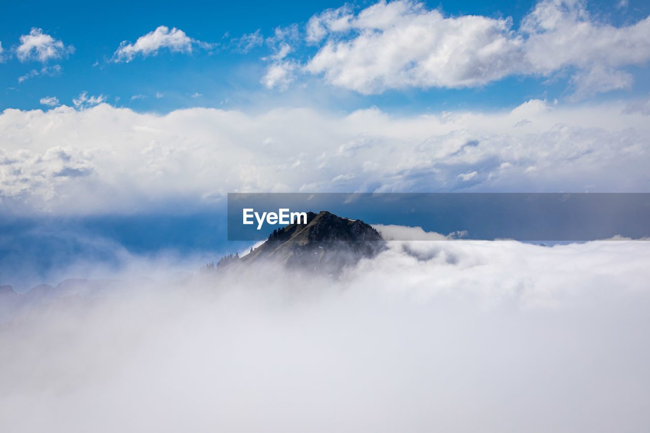 Top of mountain in a flood of clouds