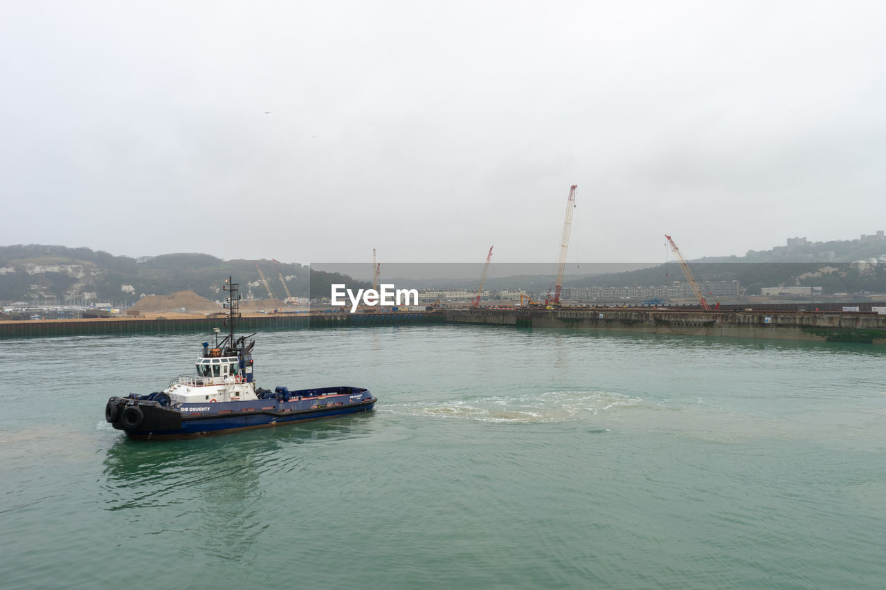 NAUTICAL VESSEL IN SEA AGAINST SKY