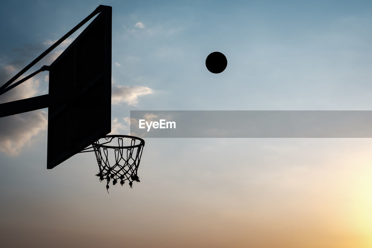 LOW ANGLE VIEW OF BASKETBALL HOOP