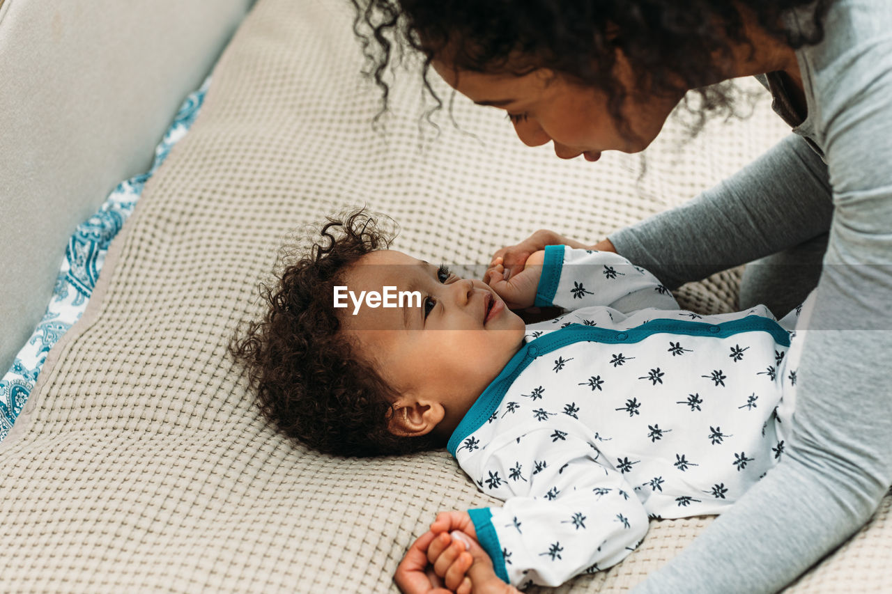 High angle view of mother and son playing at home