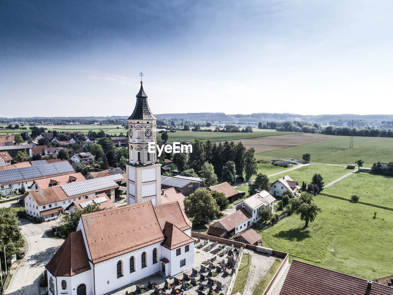 High angle view of houses in town against sky