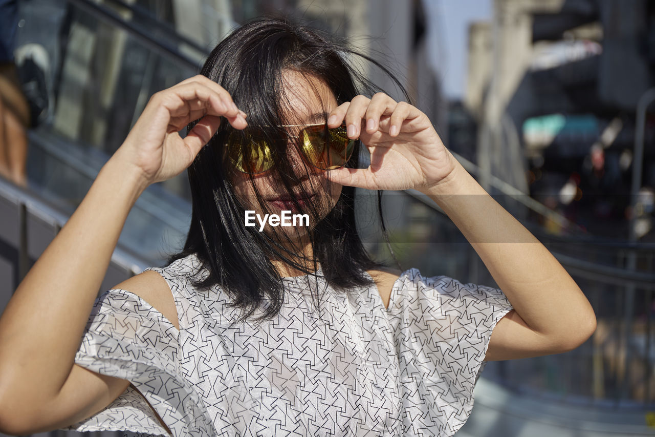 Portrait of woman wearing sunglasses