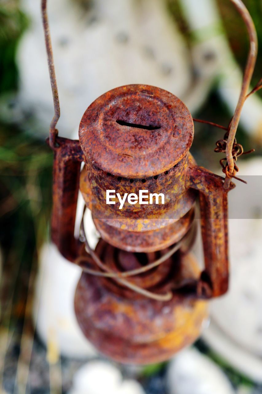 Close-up high angle view of rusty hanging lamp