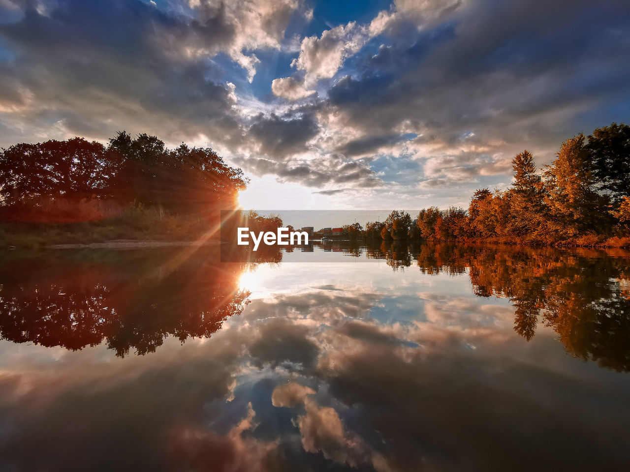Scenic view of lake against sky during sunset