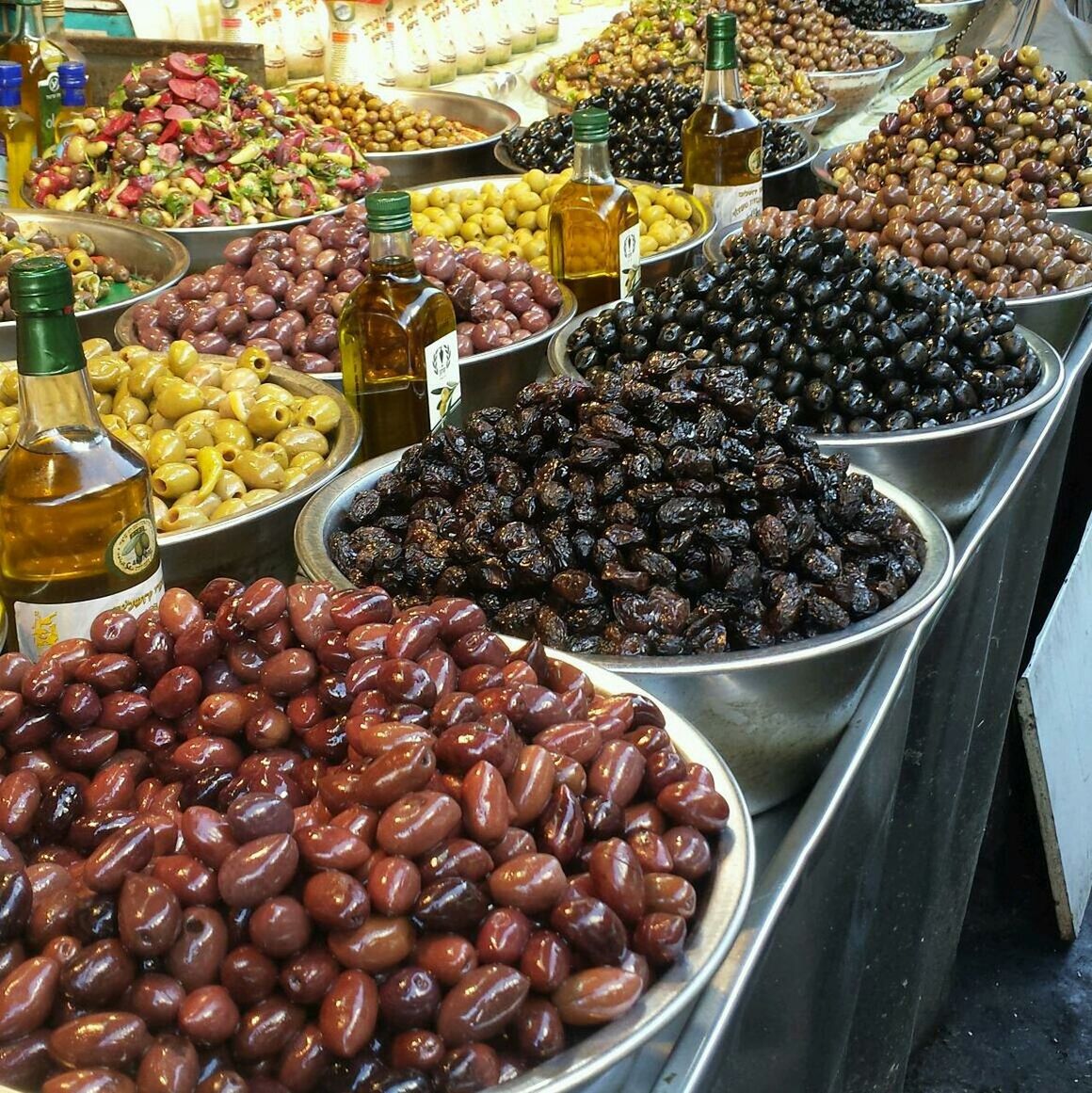 Various olives and oils for sale in shop