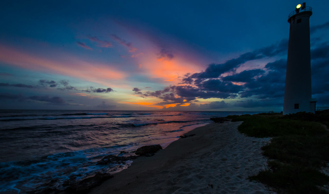 Scenic view of sea against cloudy sky