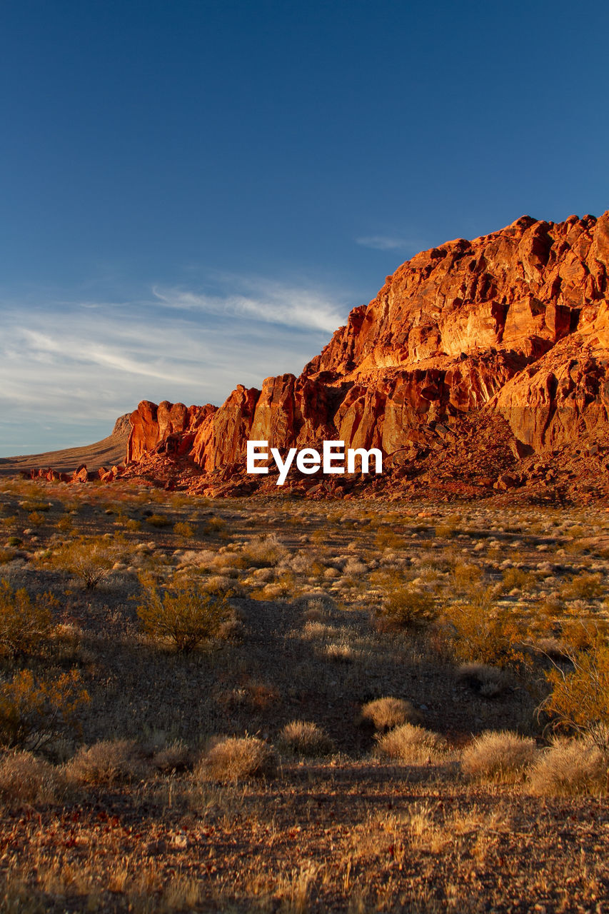 Rock formations on landscape against sky