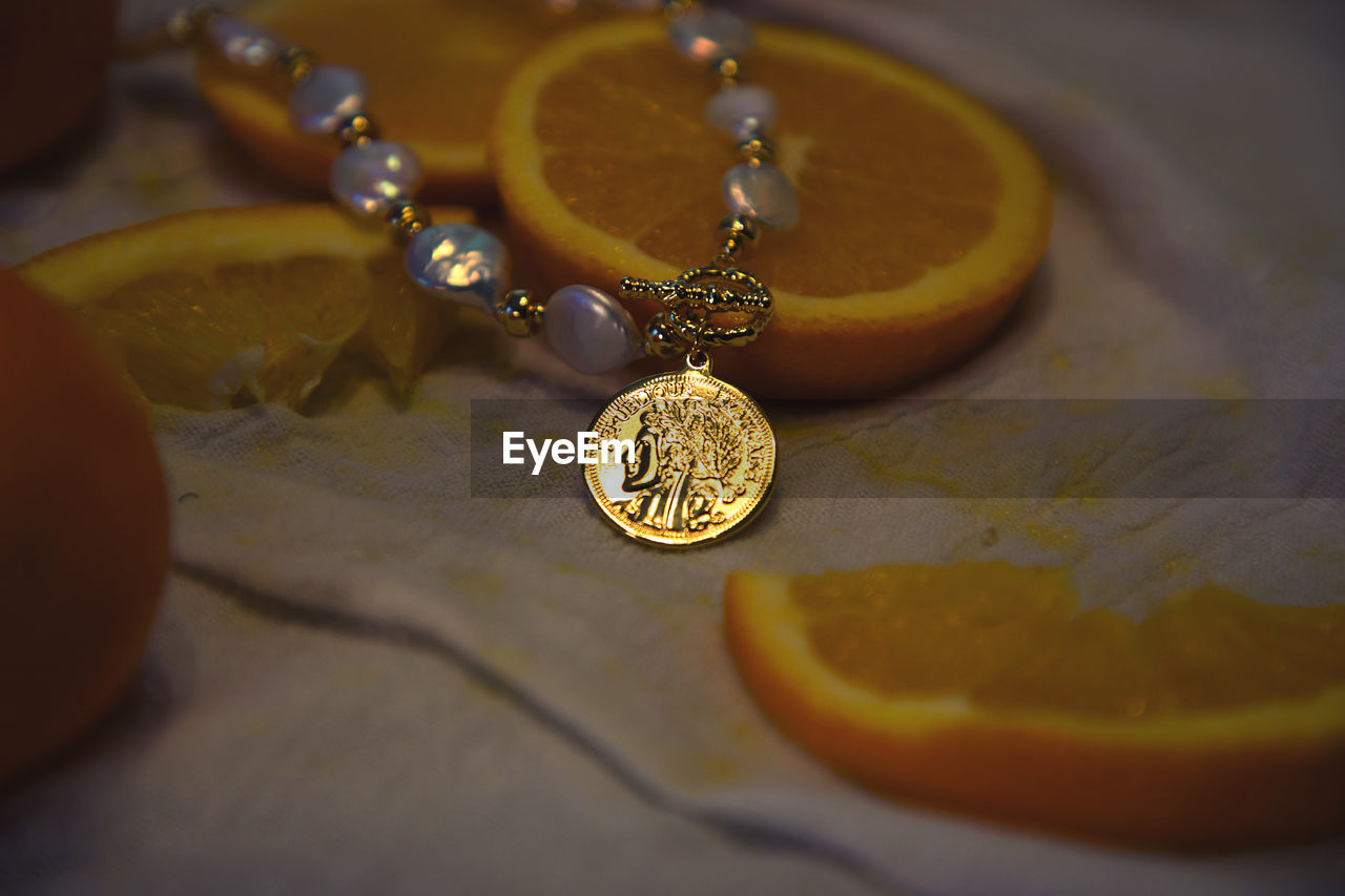 yellow, orange, jewellery, jewelry, close-up, indoors, amber, necklace, no people, fashion accessory, still life, selective focus, pendant, gold
