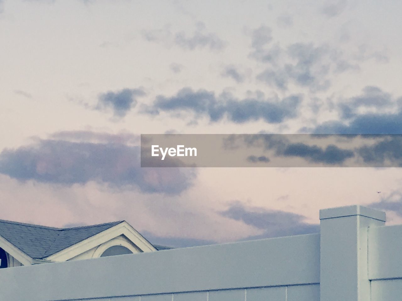 LOW ANGLE VIEW OF ROOF AGAINST SKY