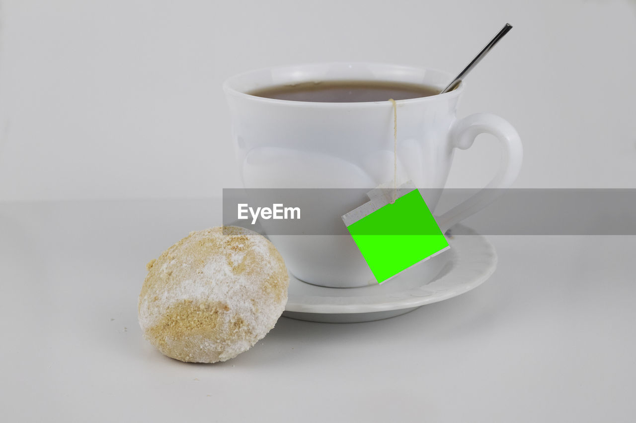 food and drink, drink, cup, mug, indoors, studio shot, food, refreshment, white background, coffee cup, freshness, no people, coffee, tea, hot drink, spoon, teabag, close-up, crockery, kitchen utensil, breakfast, eating utensil, still life, wellbeing, healthy eating, table