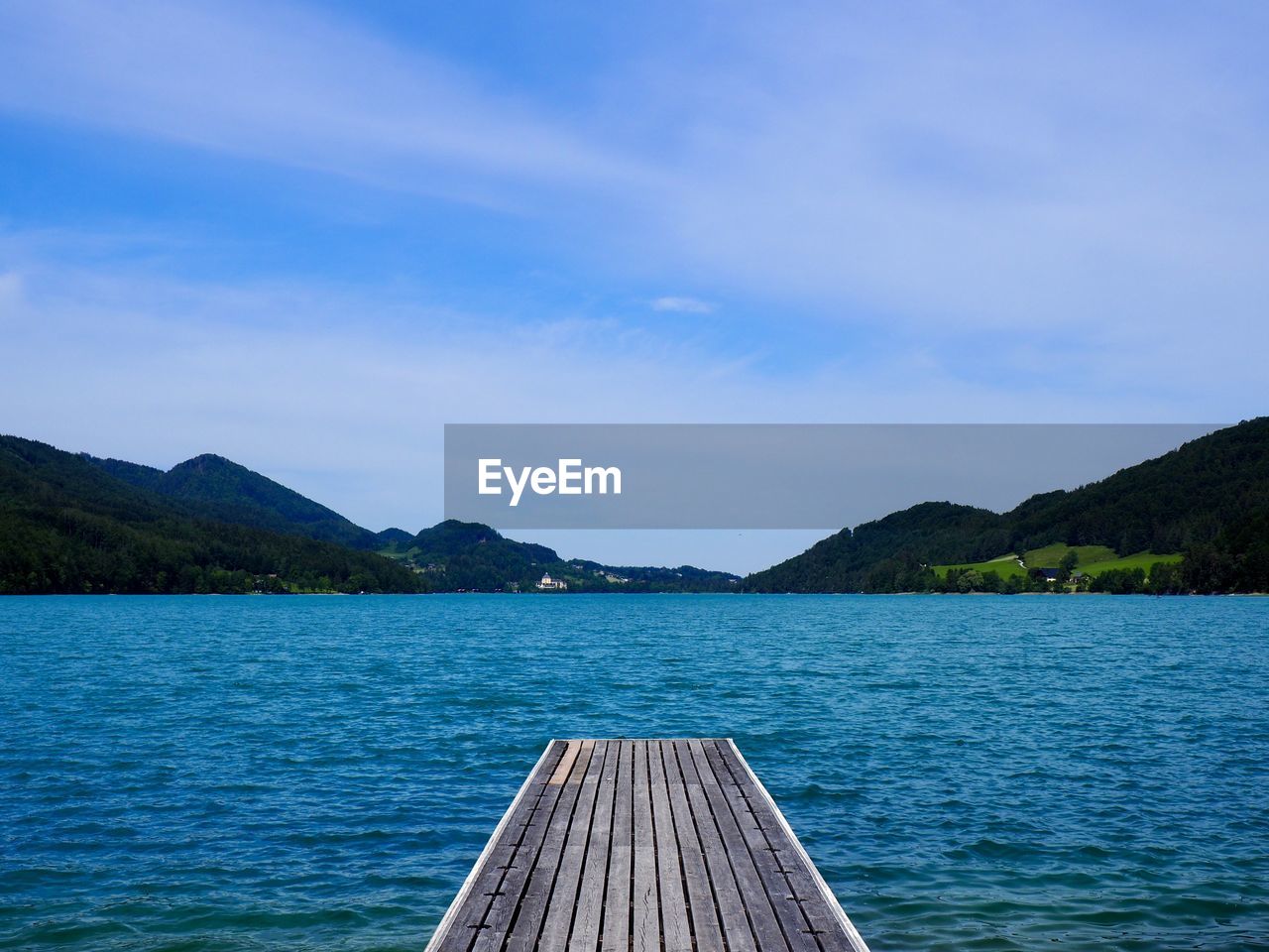 Scenic view of sea against blue sky