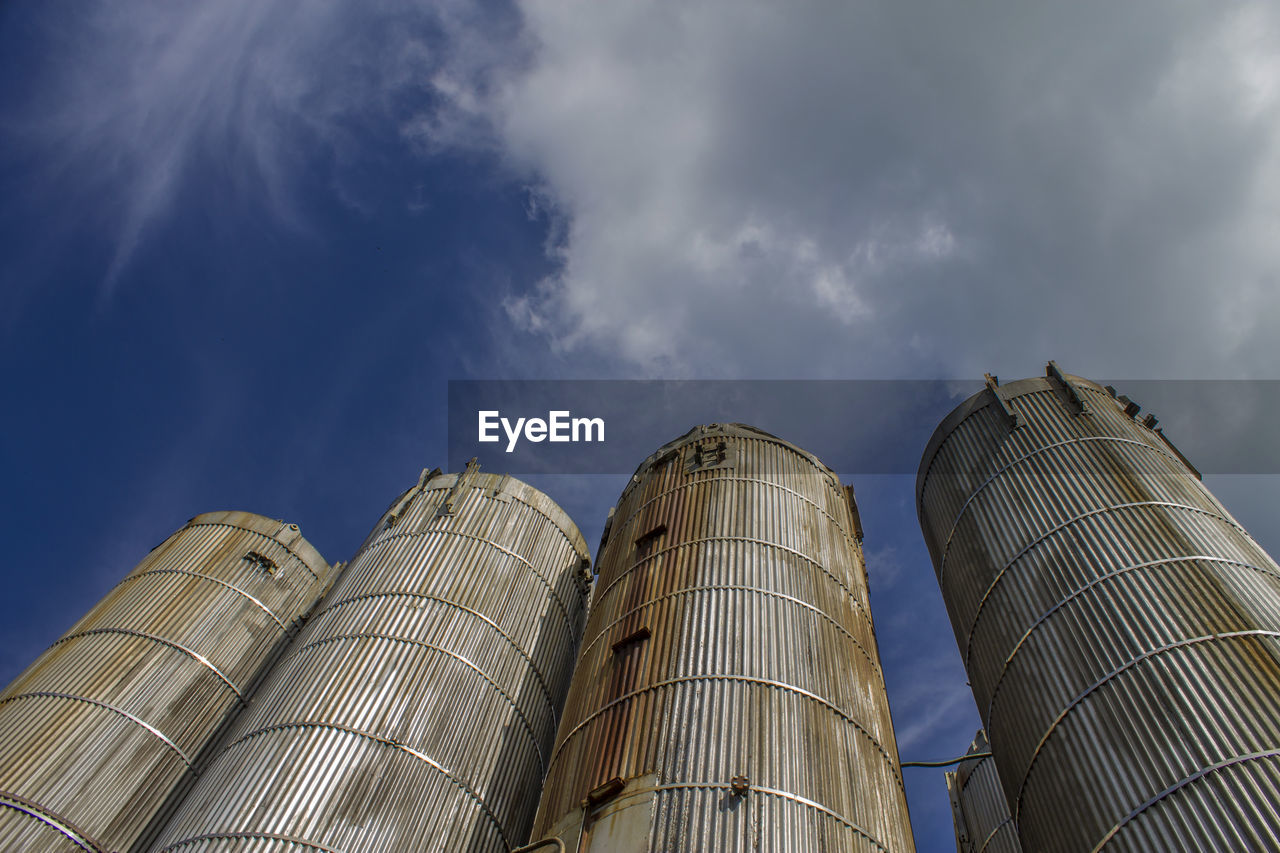 Low angle view of building against cloudy sky