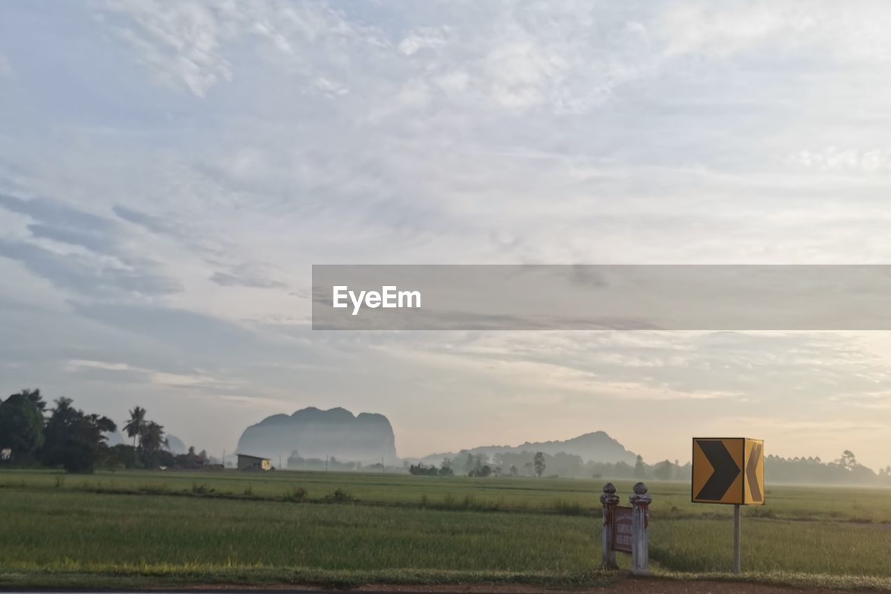 Scenic view of field against sky during sunset