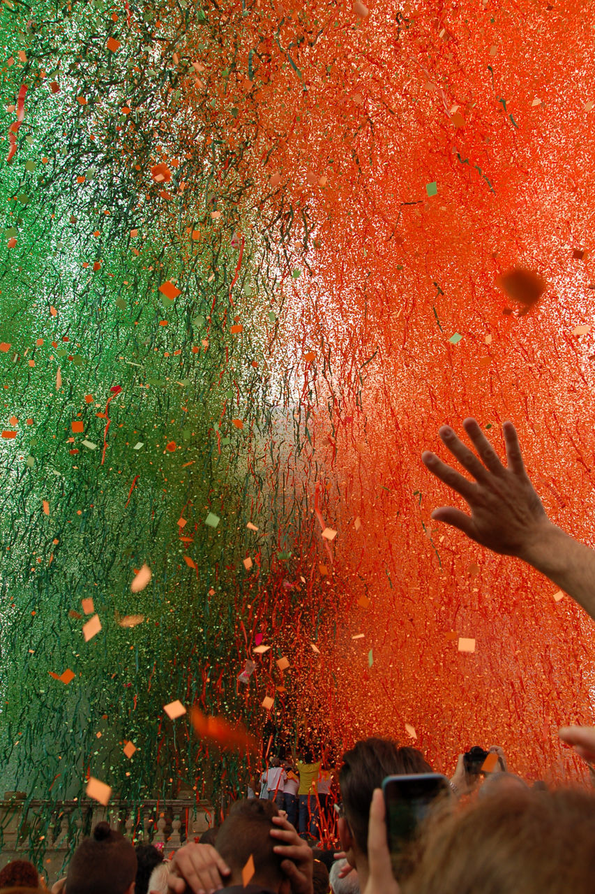 Low angle view of falling confetti