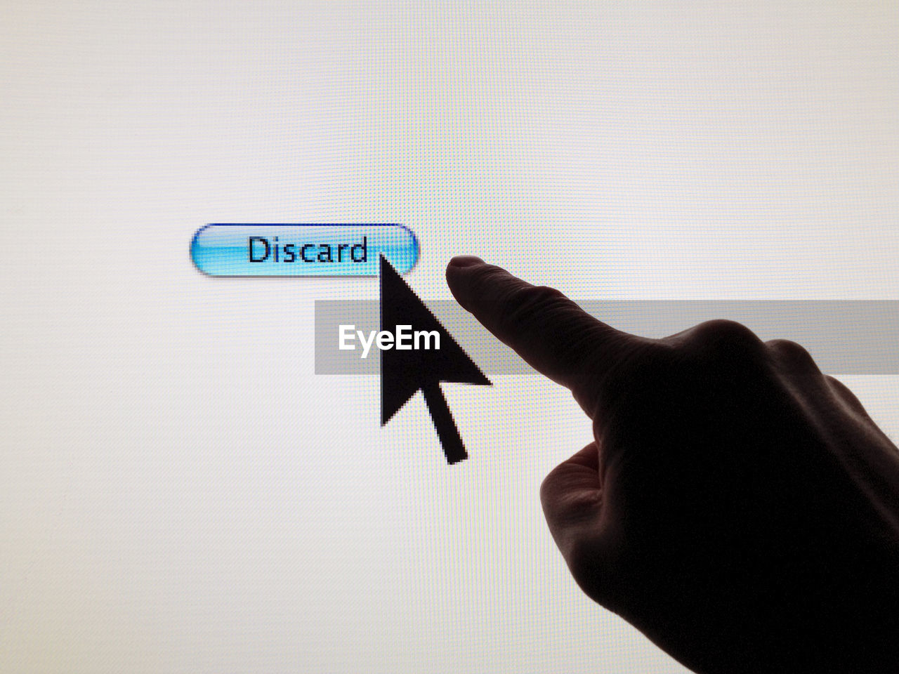 Cropped image of hand pointing on device screen