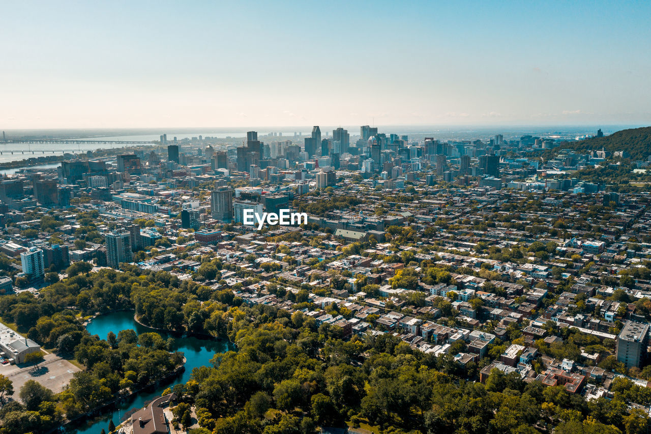 High angle view of buildings and sea against sky