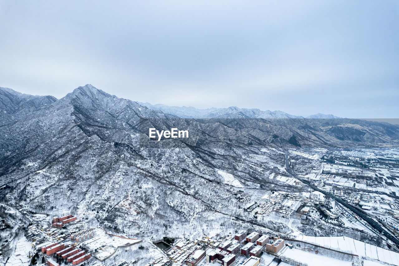 Scenic view of snowcapped mountains against sky