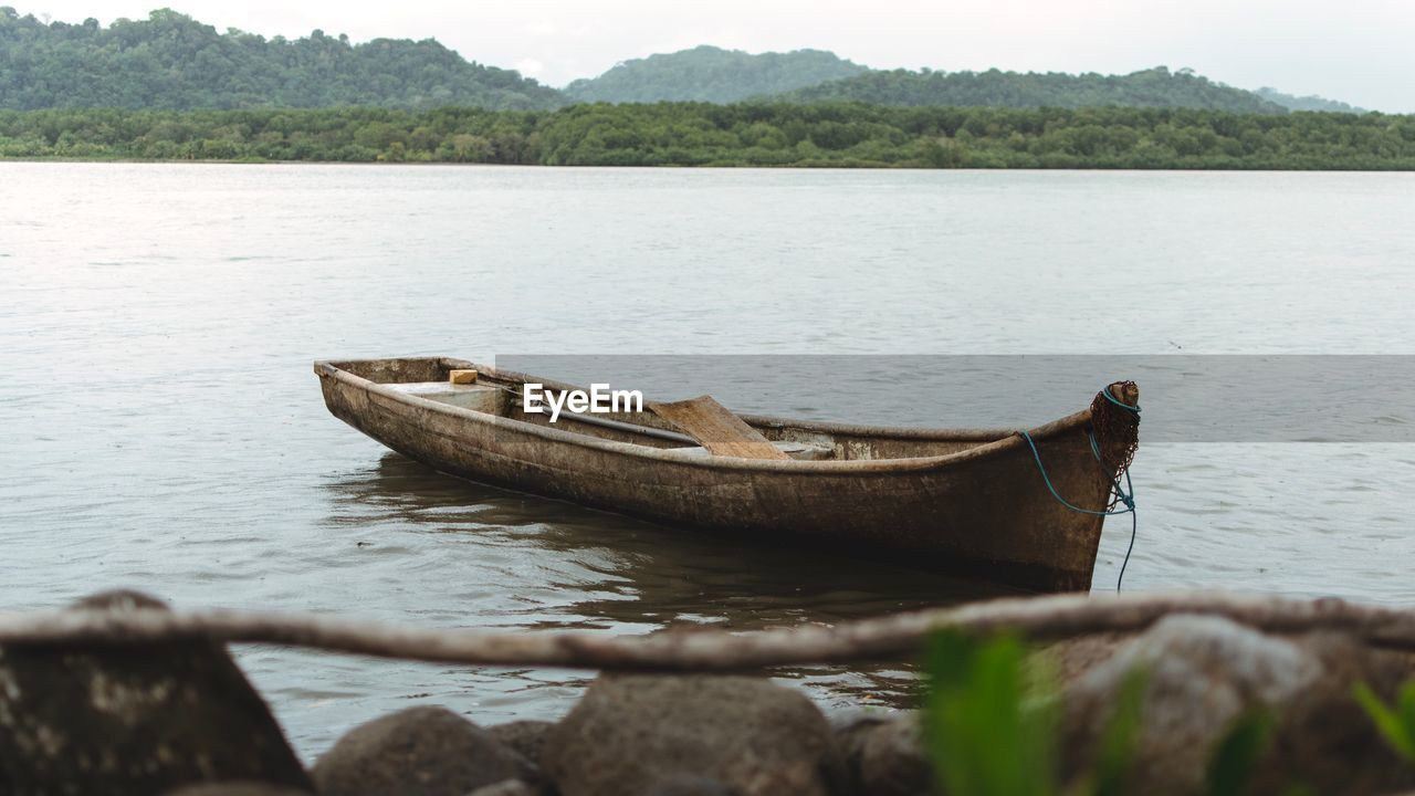 Boat moored on lake