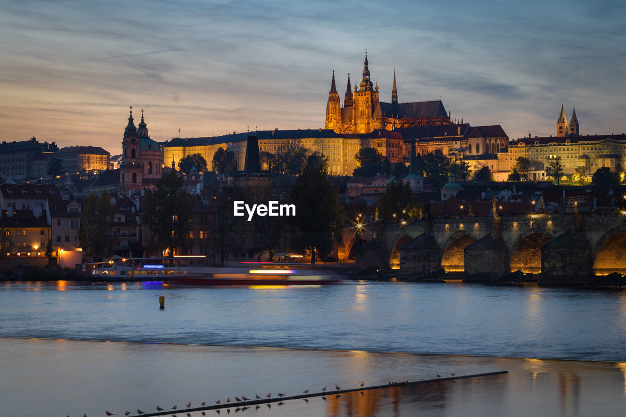 Panoramic cityscape of prague castle and charles bridge at sunset