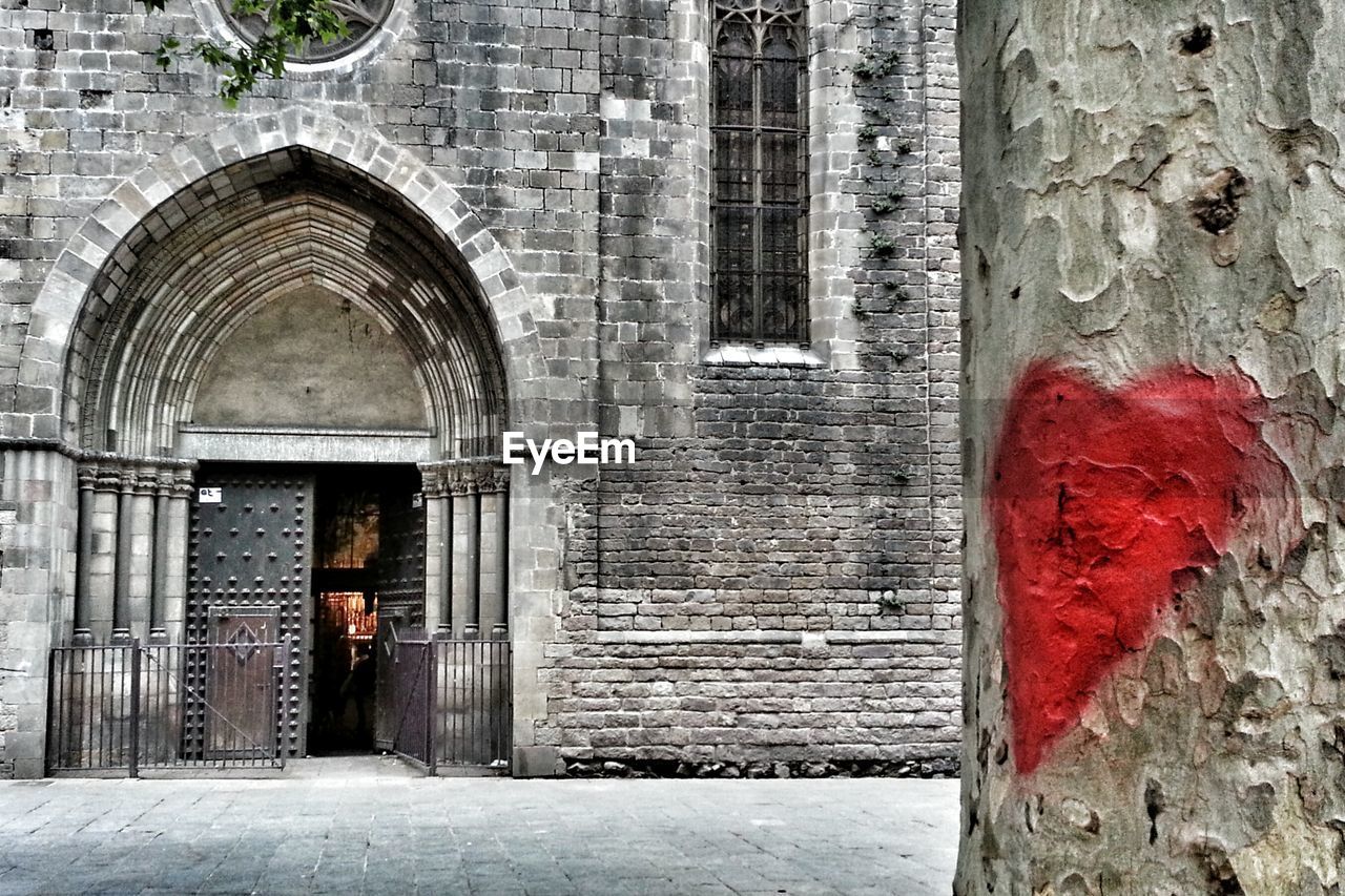 Heart shape drawing on wall with view of building entrance