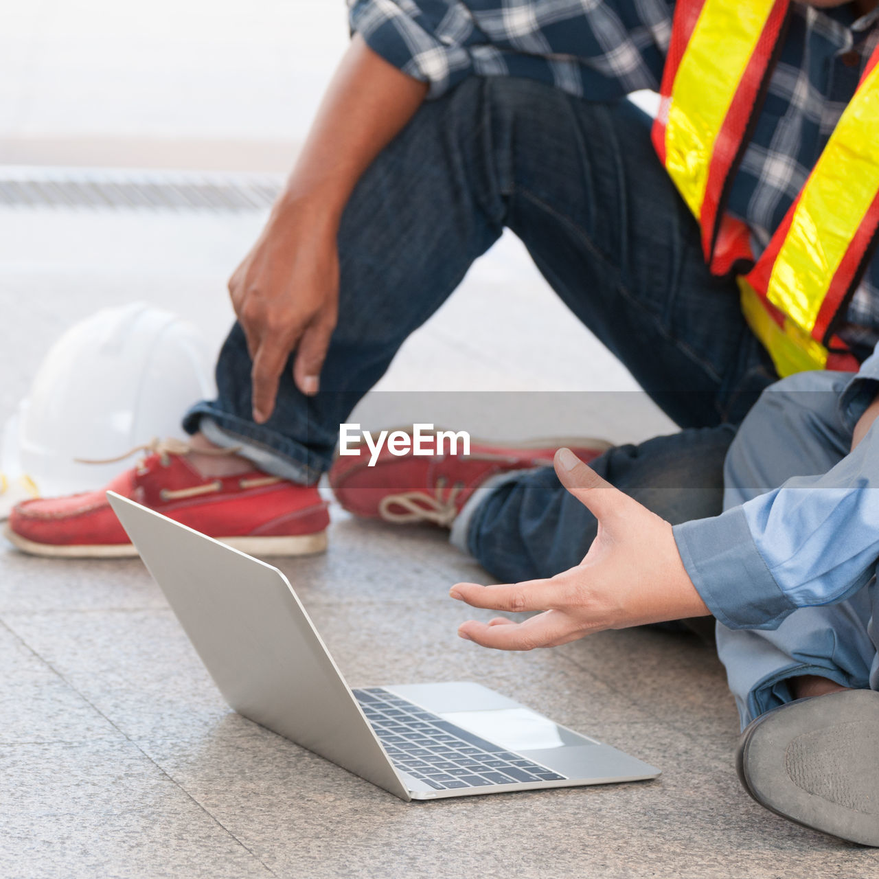 HIGH ANGLE VIEW OF MAN WORKING WITH LAPTOP