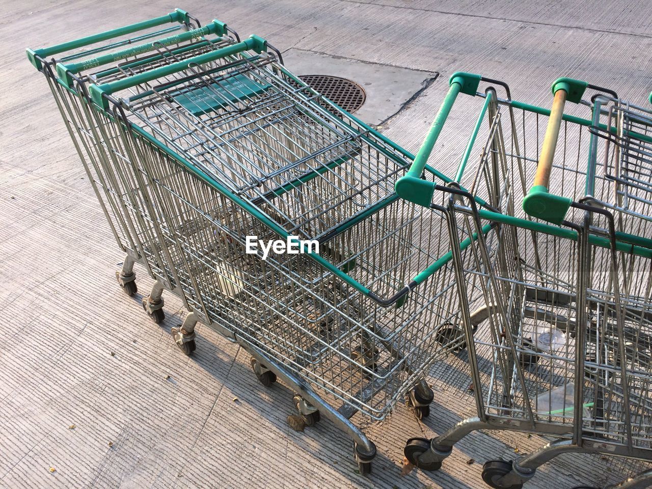 High angle view of shopping carts on footpath