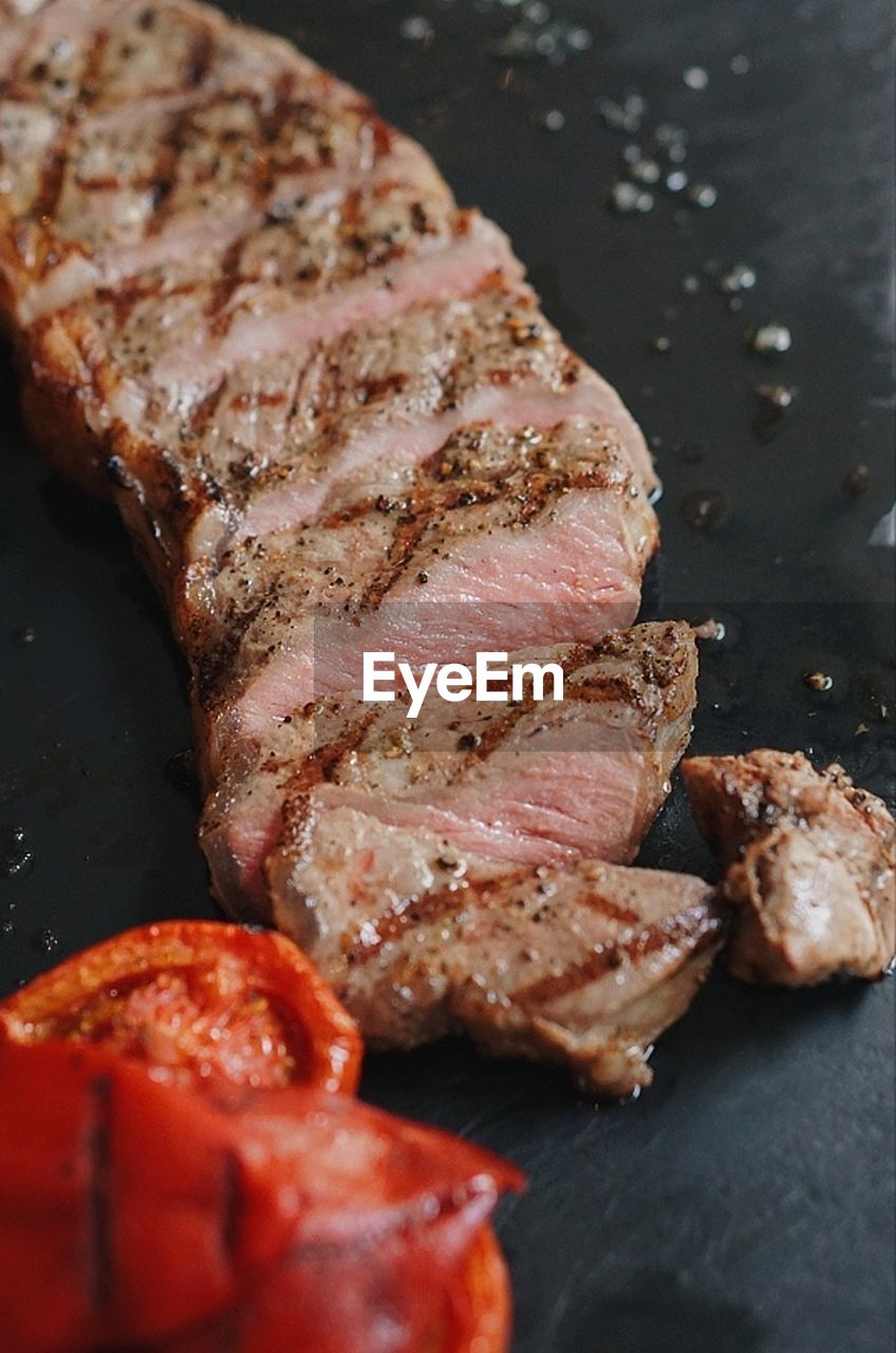 High angle view of meat on barbecue grill