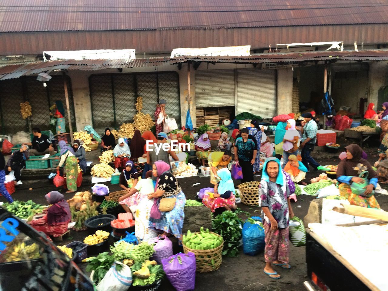 GROUP OF PEOPLE IN MARKET