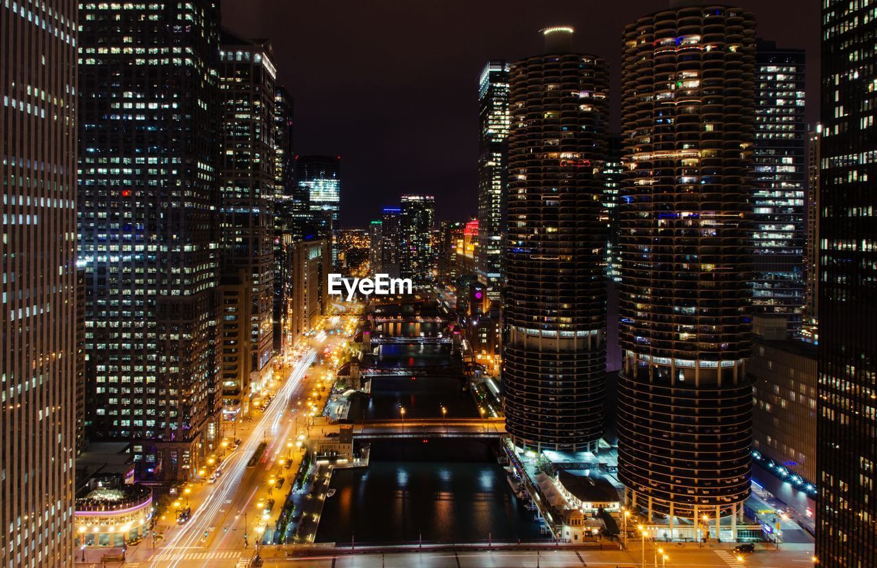 Aerial view of city lit up at night